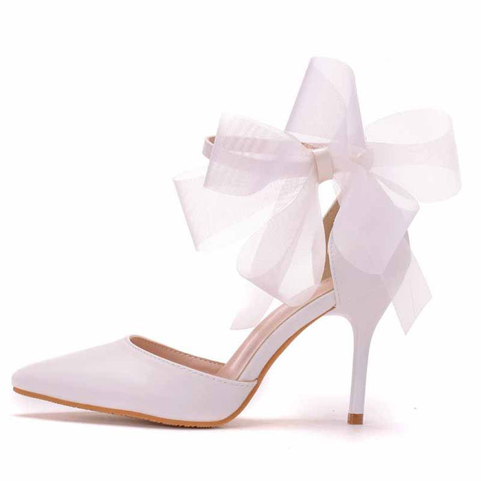 bridal closed toe high heel sandals in white with stylish bow detail for weddings