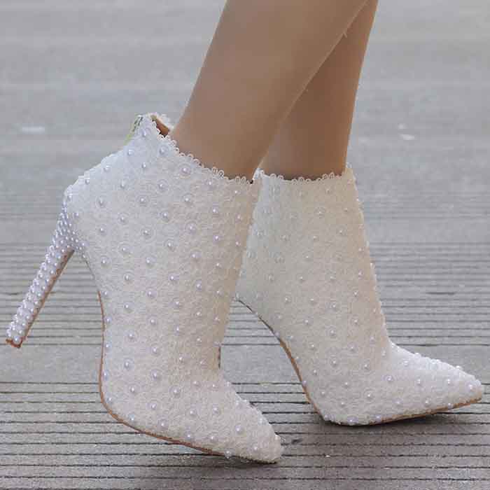 Women's white wedding ankle boots adorned with pearls and stylish high heels