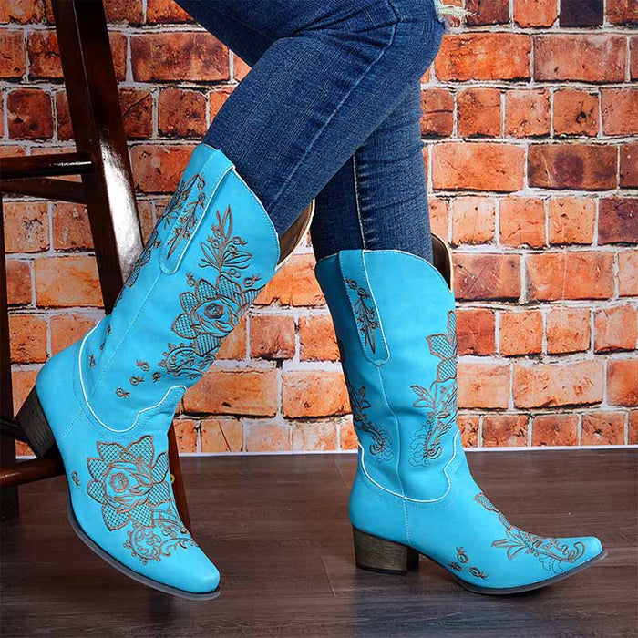 Stylish women's embroidered cowboy boots in blue with floral designs, perfect for casual and western outfits