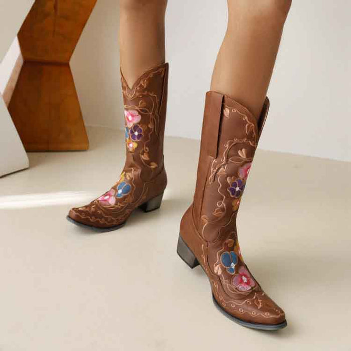 Stylish women's embroidered cowgirl boots in brown with floral designs, perfect for a trendy western look