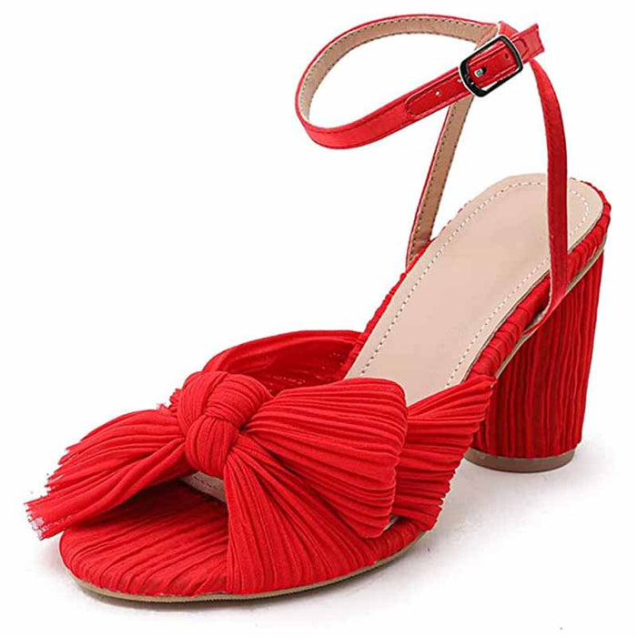 Red bridal bow knot heeled sandals with adjustable ankle strap and textured design