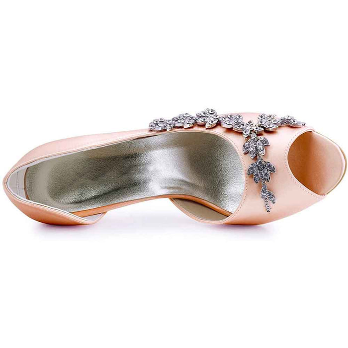 Bridal peep toe wedding heels in soft pink with elegant floral embellishments for brides