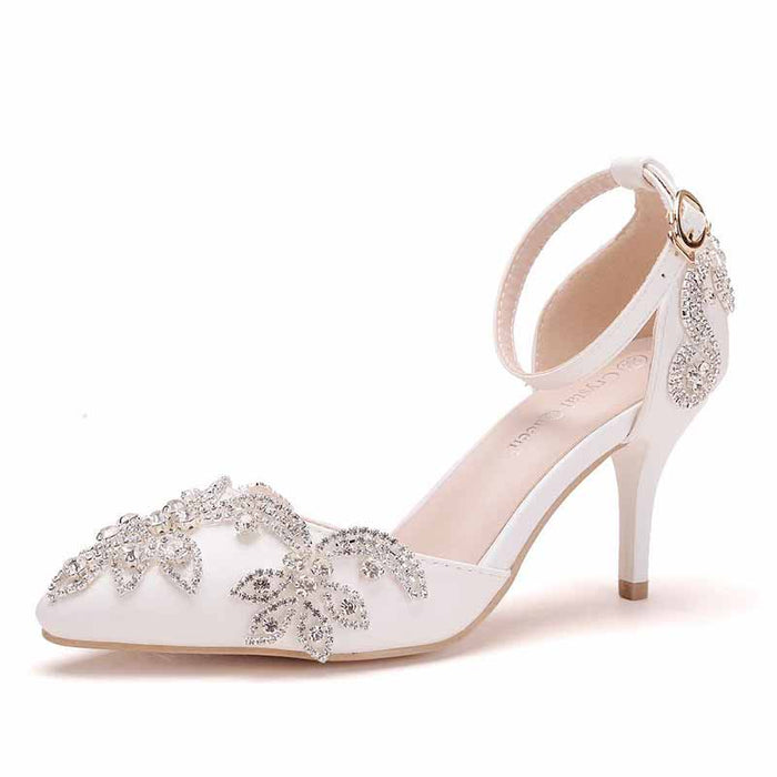 Elegant bridal crystal heels for wedding with intricate floral embellishments and a stylish ankle strap