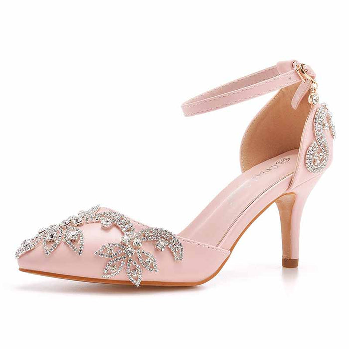 Elegant pink bridal crystal heels for wedding featuring intricate floral embellishments and a sleek ankle strap