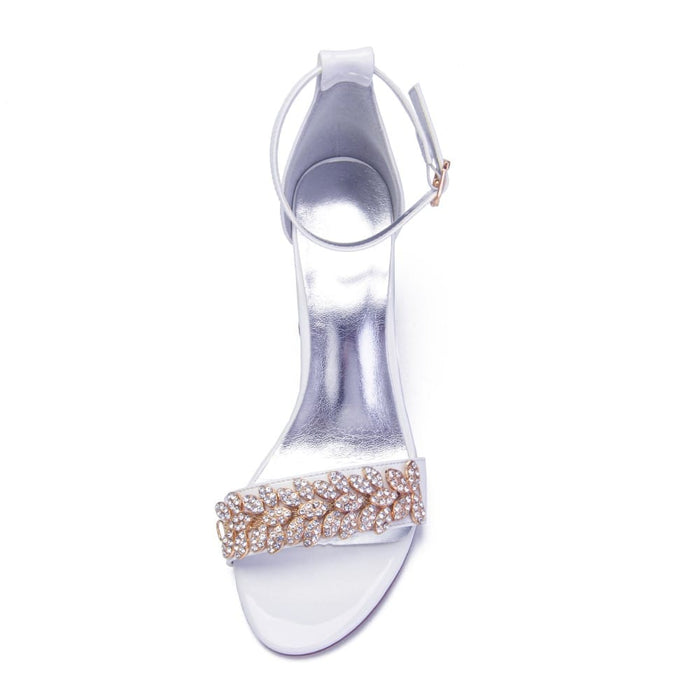 Elegant wedding heels for women with a bejeweled strap and ankle closure in white