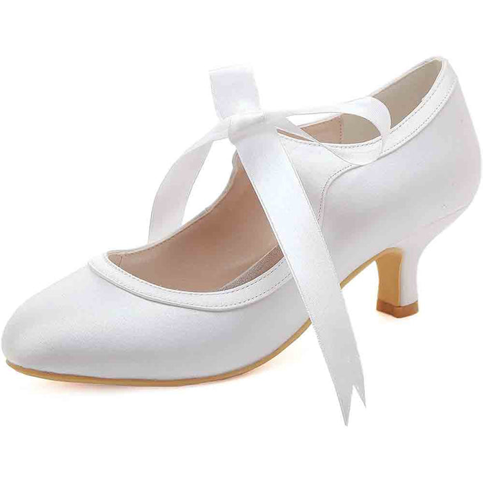 Elegant lace wedding shoes for bride in white with ribbon detail and a delicate heel