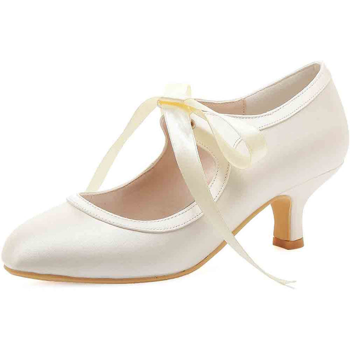 Elegant lace wedding shoes for bride with a delicate ribbon tie and stylish heel