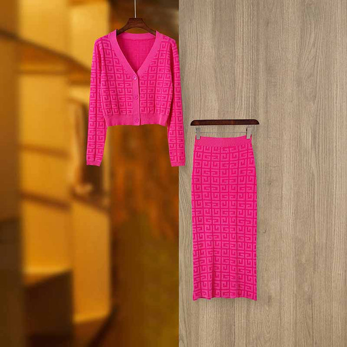 Bright pink long knitted cardigan set with geometric patterns, perfect for stylish layering