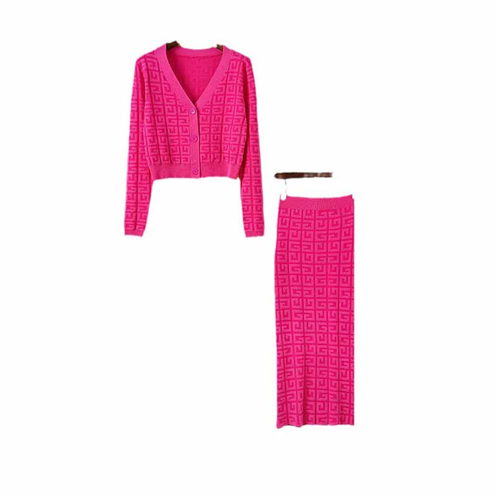 Bright pink long knitted cardigan set featuring a stylish cropped top and skirt with geometric patterns