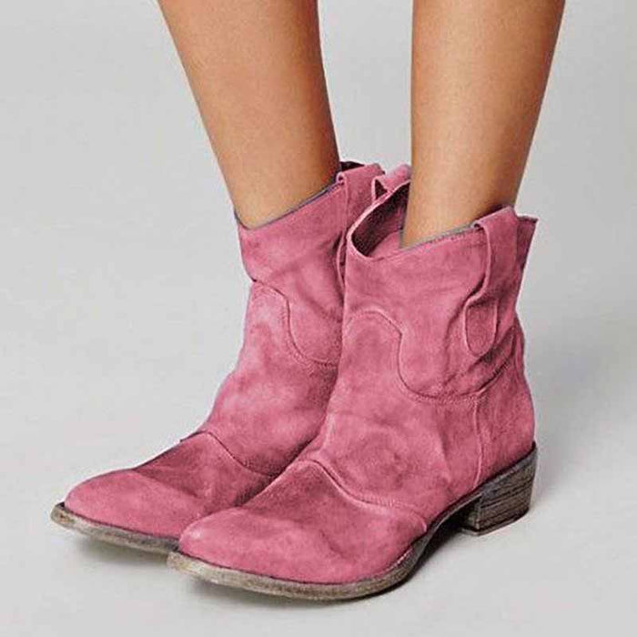 Pink suede low heel ankle booties for women with a stylish western design