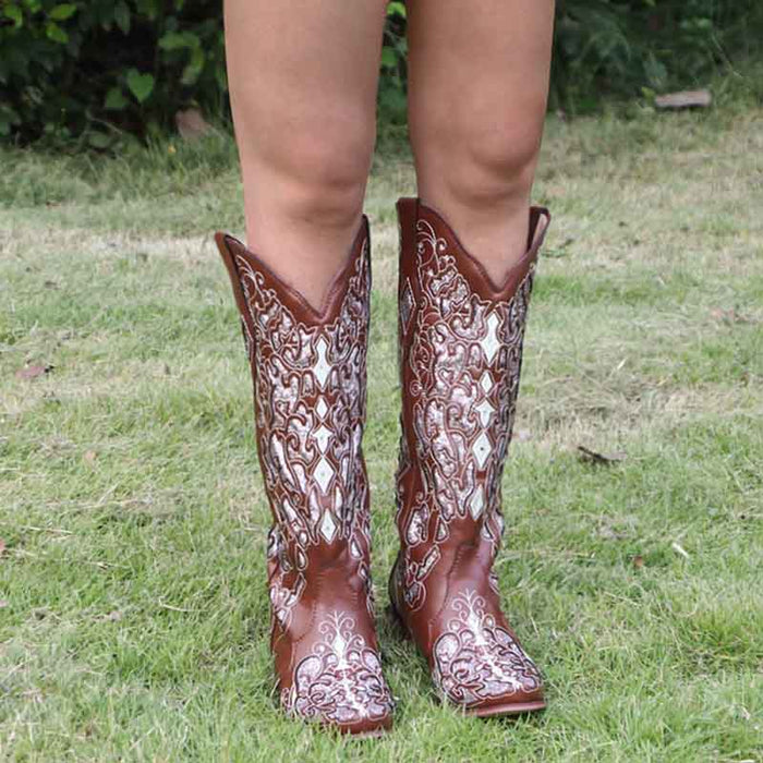 Rustic bridal cowgirl boots in brown with intricate designs for a stylish country wedding look