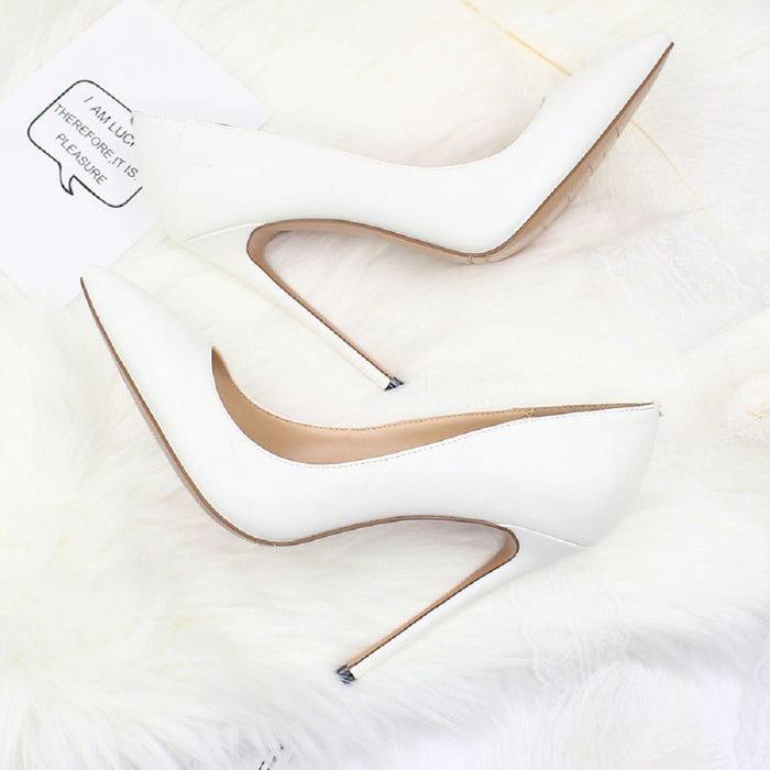 Stylish white elegant high heel shoes for weddings with sleek pointed design and stiletto heels