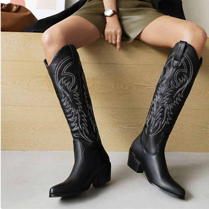 Stylish black embroidered square heel cowboy boots with intricate stitching detail, ideal for fashion-forward outfits