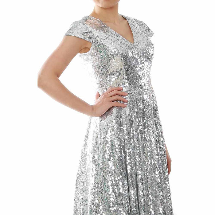 Elegant sequin mother of the bride dress in silver with a flattering V-neck and a beautiful flowy design