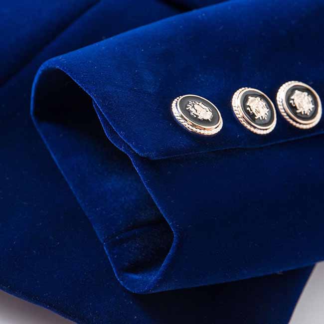 Close-up of a velvet wedding blazer featuring elegant silver buttons for stylish bridal wear