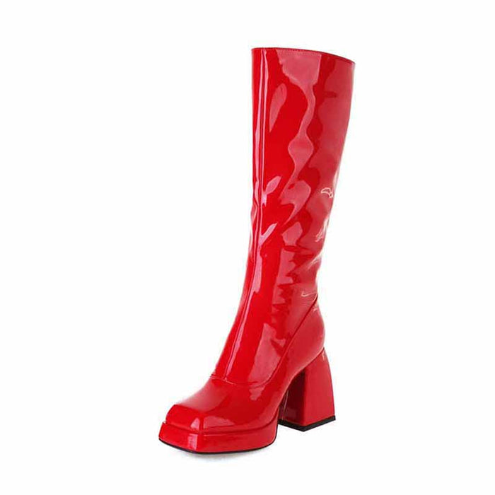Red women's knee high boots with chunky heel, showcasing a stylish glossy finish and fashionable design