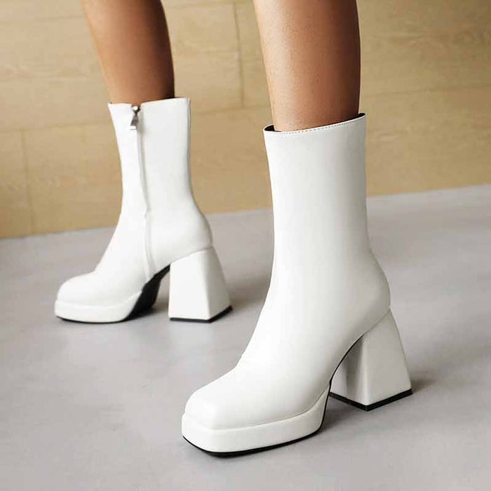 Stylish white women's patent leather ankle boots with chunky heels for a modern look