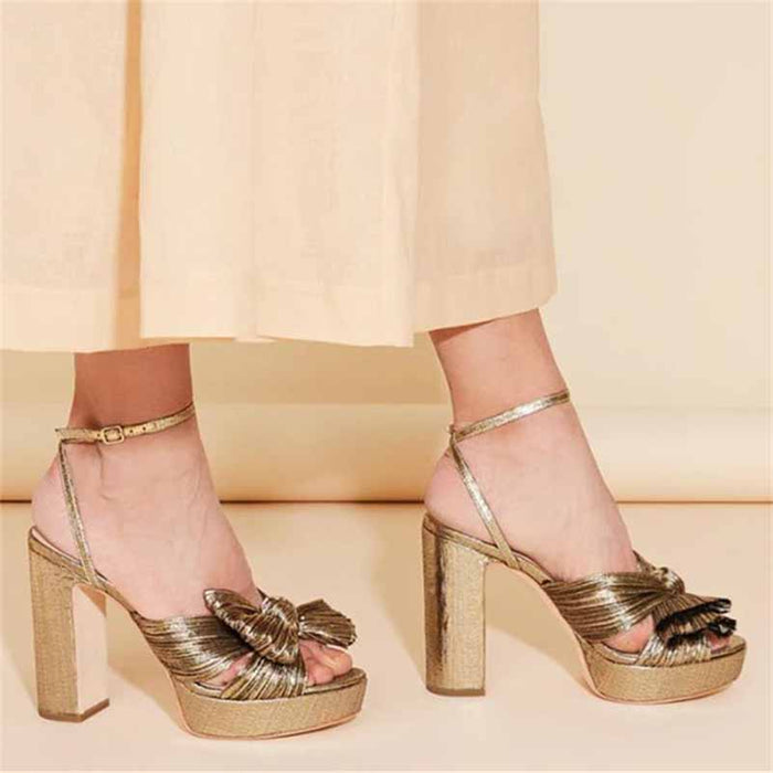 Women's platform bow sandals in gold with ankle strap for stylish wedding footwear