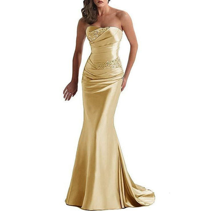 Elegant gold beaded mermaid evening dress featuring a strapless design and fitted silhouette