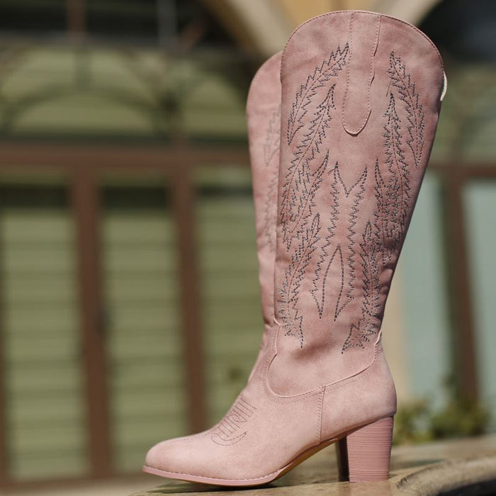 Stylish pink cowboy boots for bridesmaids with decorative stitching and sturdy heels
