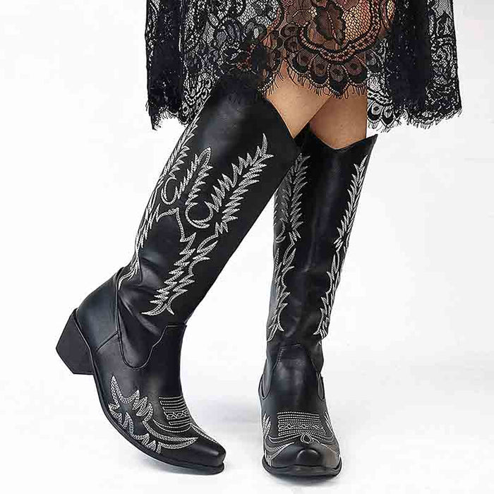 Stylish women's western cowboy boots with intricate silver stitching and low heel design