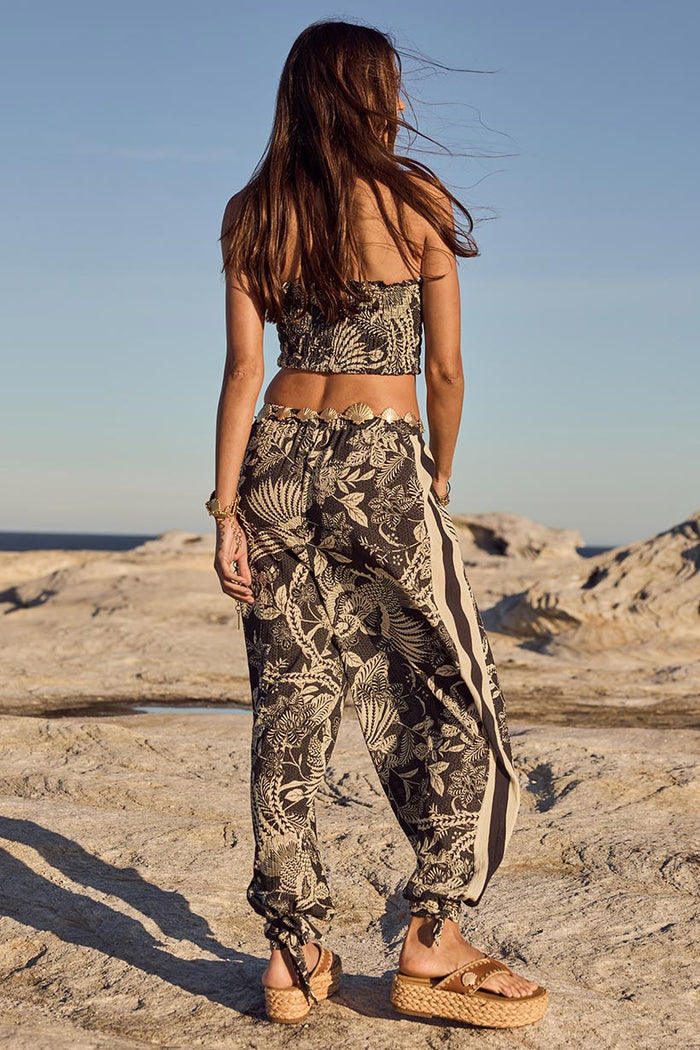 Back view of Volcano Goddess Harem Pant in Liquorice, showing side stripe detail and tie hem cuffs