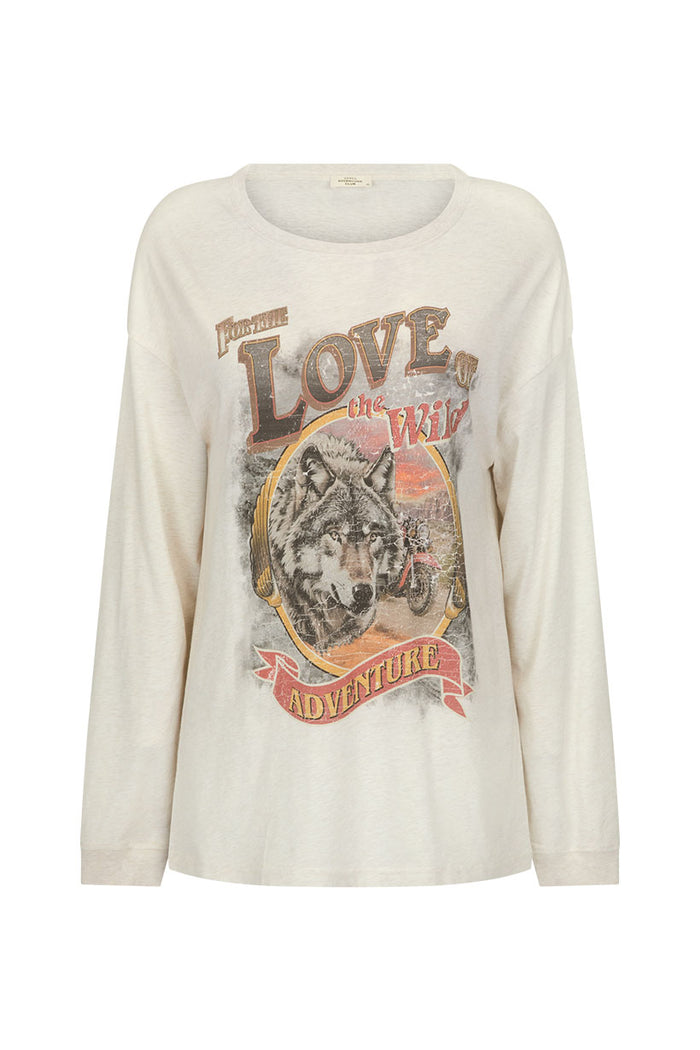 Flat lay front view of cream marle long sleeve tee with wolf adventure graphic print and rib neckband