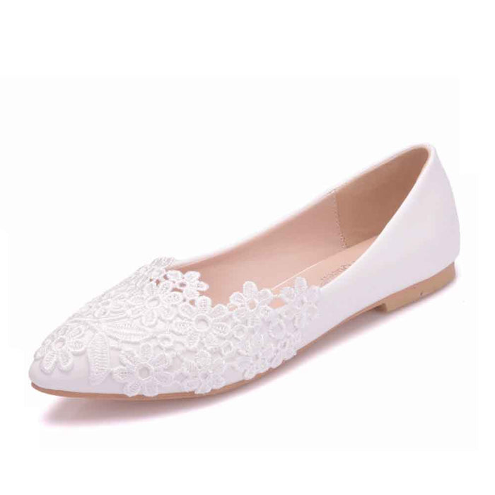Women's bridal flats in white with floral lace embellishments for elegant wedding wear