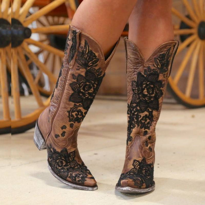 Stylish women's embroidered cowboy boots featuring floral designs on a brown leather base
