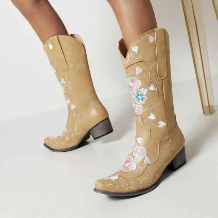 Stylish women's embroidered cowgirl boots in tan with floral designs and a stylish heel