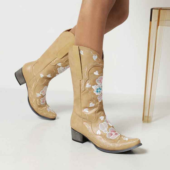 Women's embroidered cowgirl boots in tan with floral design, perfect for stylish Western looks.