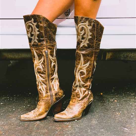 Womens embroidered snip toe boots in distressed brown with ornate stitching details for a stylish cowboy look