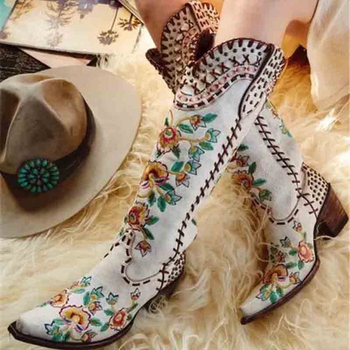Stylish women's embroidered western cowboy boots with colorful floral designs and unique stitching