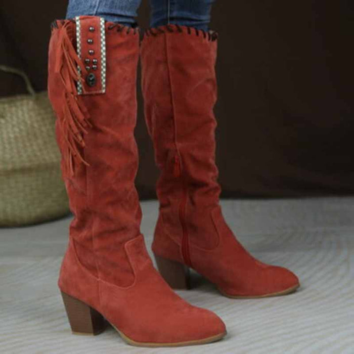 Stylish women's knee high cowgirl boots in red suede with fringe detail and decorative studs