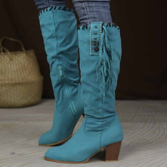 Stylish women's knee high cowgirl boots in turquoise with fringe and button details