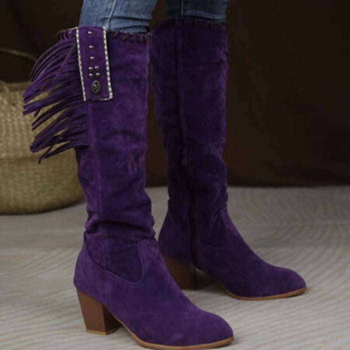 Stylish women's knee high cowgirl boots in purple with fringe detail and block heels