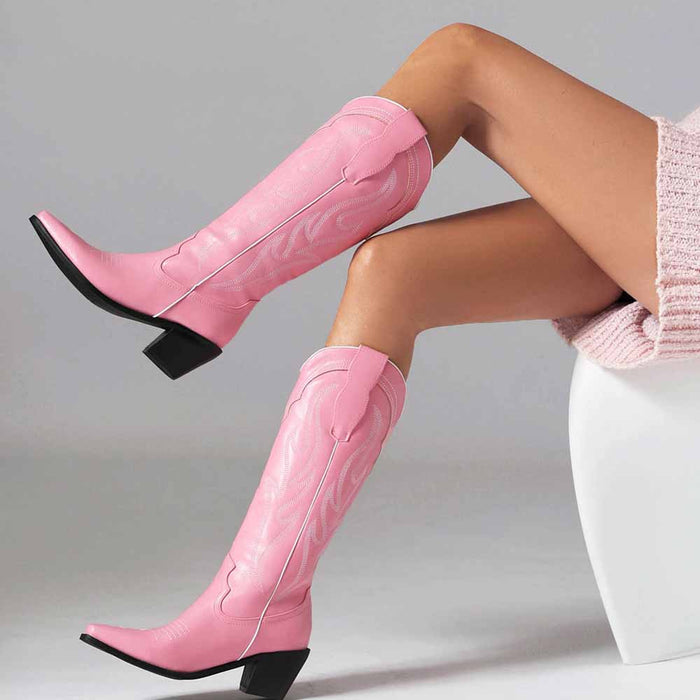 Stylish women's knee high western boots in pink leather with a chic heel design