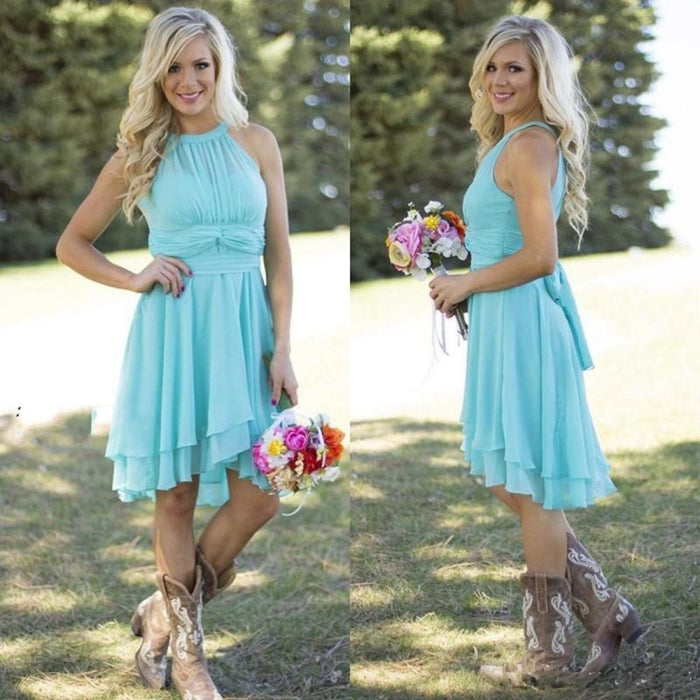 Blue knee length country bridesmaid dress by sd-hk worn with cowboy boots outdoors holding a bouquet