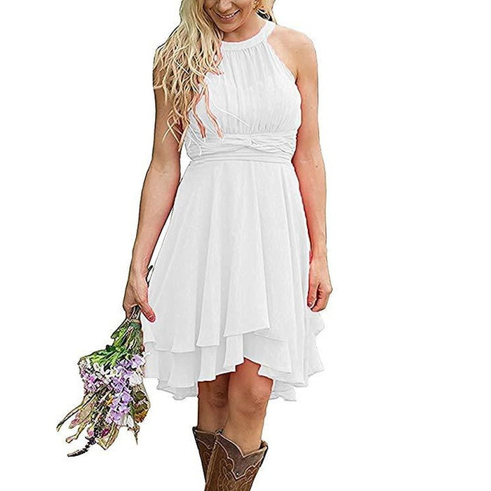 White sleeveless knee length country bridesmaid dress with layered skirt worn with brown boots