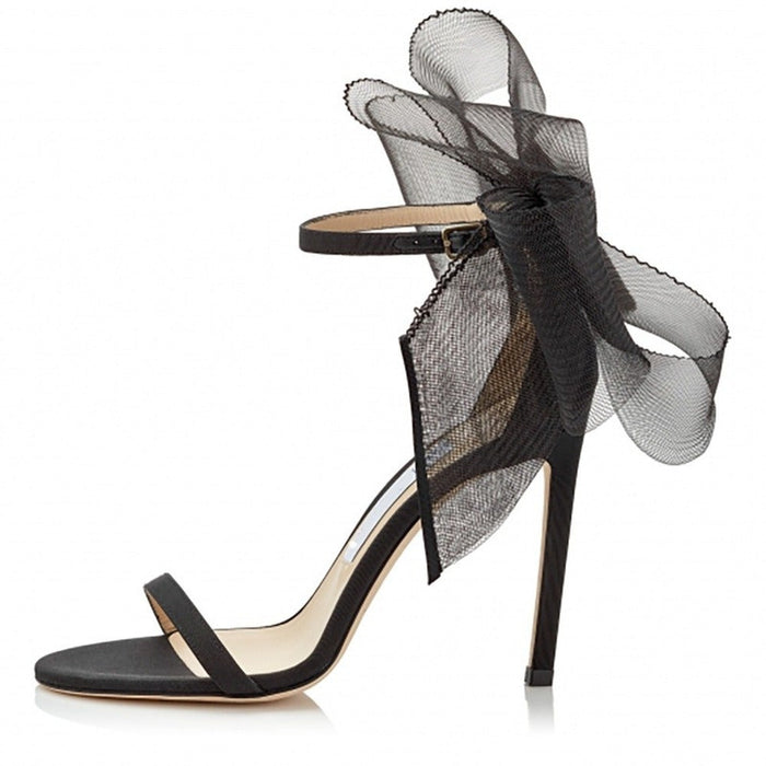 Women's lace up stiletto party sandals in black with elegant tulle bow detail