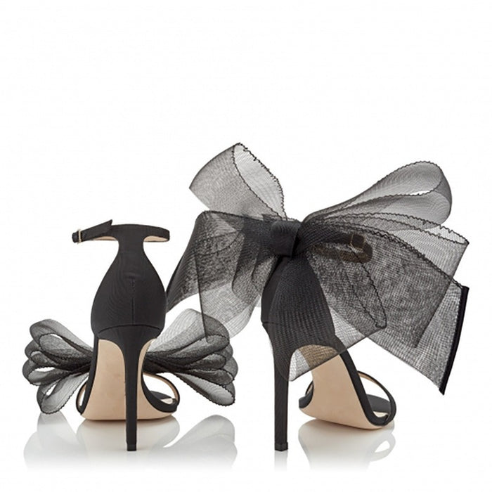 Women's lace up stiletto party sandals with elegant bow detail in black