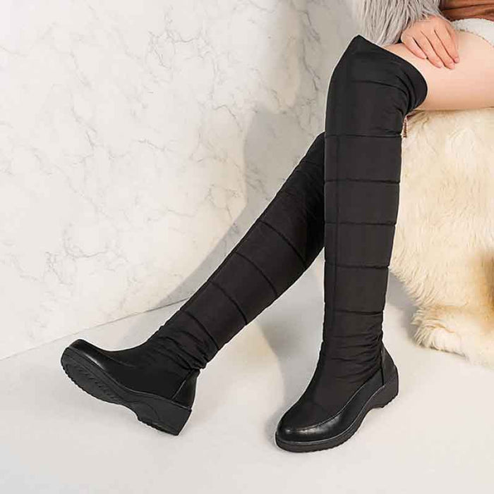 Womens over the knee snow boots in black, stylish and warm for winter wear