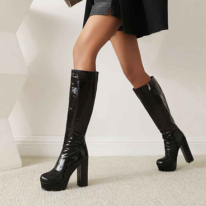 Stylish women's patent leather knee high boots with chunky heels and a sleek finish