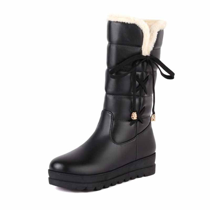 Women's waterproof winter boots with faux fur lining and lace-up design for cold weather
